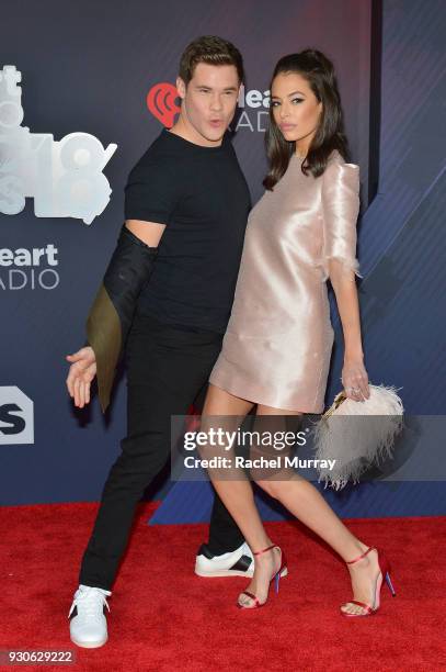 Adam DeVine and Chloe Bridges arrive at the 2018 iHeartRadio Music Awards which broadcasted live on TBS, TNT, and truTV at The Forum on March 11,...