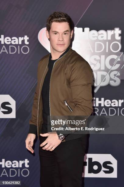 Adam DeVine arrives at the 2018 iHeartRadio Music Awards which broadcasted live on TBS, TNT, and truTV at The Forum on March 11, 2018 in Inglewood,...