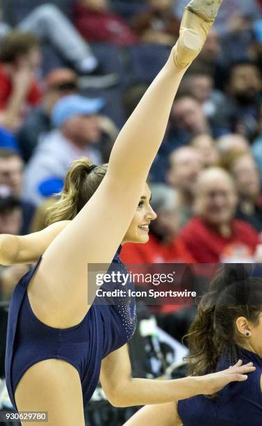 Rhode Island cheerleader performs a dance number during the final of the 2018 Atlantic 10 men's basketball tournament between the Rhode Island Rams...