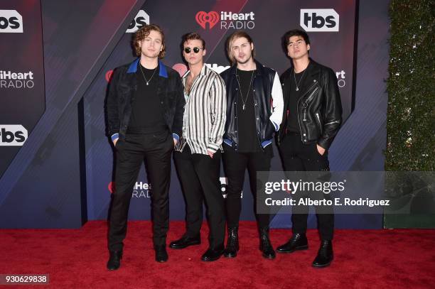 Ashton Irwin, Luke Hemmings, Michael Clifford, and Calum Hood of 5 Seconds of Summer arrive at the 2018 iHeartRadio Music Awards which broadcasted...