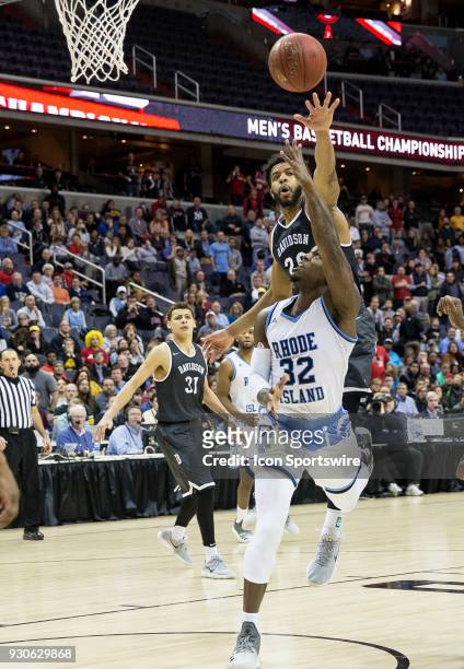Rhode Island Rams guard Jared Terrell tossed an underhand shot over Davidson Wildcats guard KiShawn Pritchett during the final of the 2018 Atlantic...