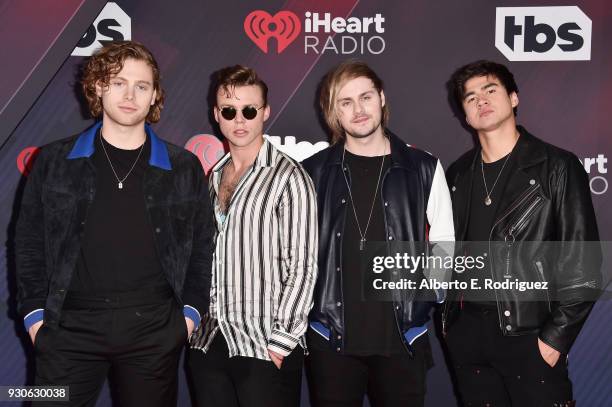 Ashton Irwin, Luke Hemmings, Michael Clifford, and Calum Hood of 5 Seconds of Summer arrive at the 2018 iHeartRadio Music Awards which broadcasted...