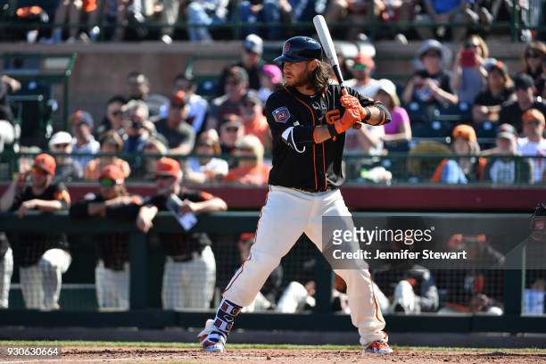 Brandon Crawford of the San Francisco Giants bats in the spring training game against the Kansas City Royals at Scottsdale Stadium on February 26,...