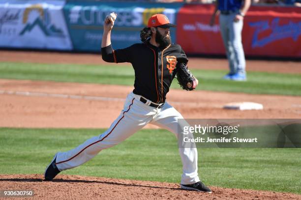 Cory Gearrin of the San Francisco Giants delivers a pitch in the spring training game against the Kansas City Royals at Scottsdale Stadium on...