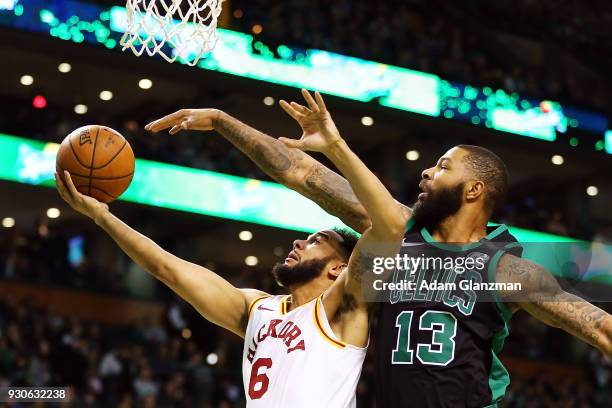 Cory Joseph of the Indiana Pacers goes for a layup while guarded by Marcus Morris of the Boston Celtics during a game at TD Garden on March 11, 2018...