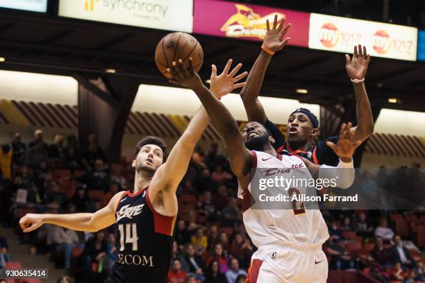 Scoochie Smith of the Canton Charge goes for a lay up against Beau Beech of the Erie BayHawks on March 11, 2018 at Canton Memorial Civic Center in...