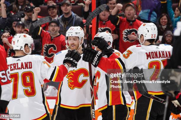 Sam Bennett of the Calgary Flames celebrates his first period goal against the Ottawa Senators with teammates Micheal Ferland, Dougie Hamilton and...