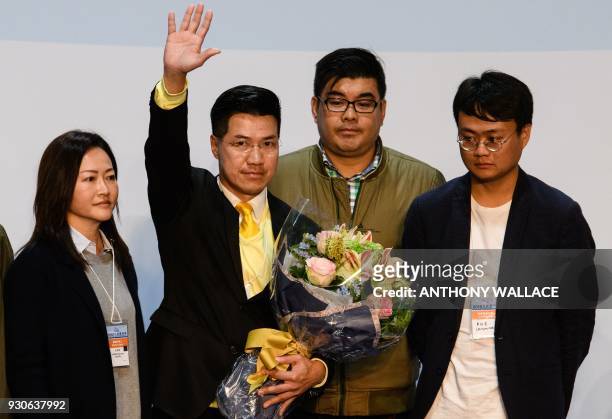Pro-democracy candidate Gary Fan celebrates after beating pro-government candidate Bill Tang in the Legislative Council by-election for the New...