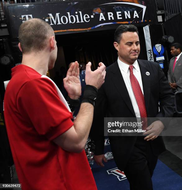 Head coach Sean Miller of the Arizona Wildcats walks onto the court before a semifinal game of the Pac-12 basketball tournament against the UCLA...