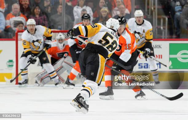 Kris Letang of the Pittsburgh Penguins takes a shot on goal against the Philadelphia Flyers on March 7, 2018 at the Wells Fargo Center in...