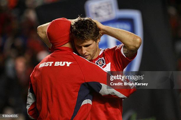 Chris Rolfe hugs Logan Pause of the Chicago Fire after loosing to Real Salt Lake in the MLS Eastern Conference Championship at Toyota Park on...