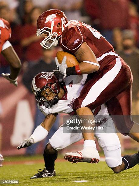 November 14: D.J. Williams of the Arkansas Razorbacks runs the ball for a touchdown against the Troy Trojans at Donald W. Reynolds Stadium on...