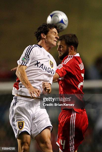 Daniel Woolard of the Chicago Fire and Will Johnson of Real Salt Lake go up for a header during the first half of the MLS Eastern Conference...
