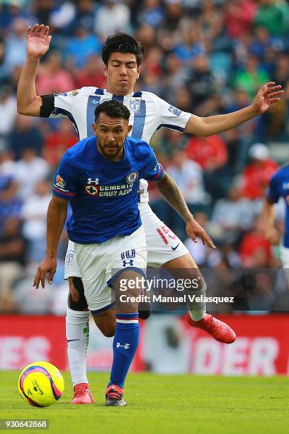 Walter Montoya of Cruz Azul struggles for the ball against Erick Gutierrez of Pachuca during the 11th round match between Cruz Azul and Pachuca as...