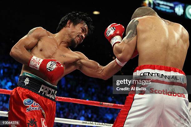 Manny Pacquiao throws a left to the head of Miguel Cotto during their WBO welterweight title fight at the MGM Grand Garden Arena on November 14, 2009...