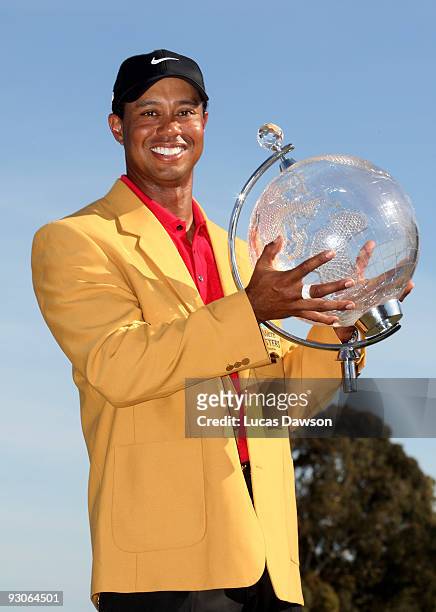 Tiger Woods of the USA poses with the trophy after the final round of the 2009 Australian Masters at Kingston Heath Golf Club on November 15, 2009 in...