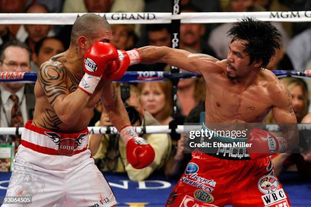 Manny Pacquiao throws a right to the head of Miguel Cotto during their WBO welterweight title fight at the MGM Grand Garden Arena on November 14,...