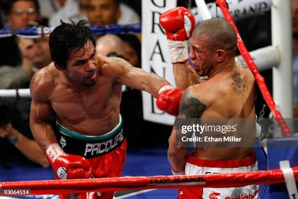 Manny Pacquiao throws a left to the body of Miguel Cotto during their WBO welterweight title fight at the MGM Grand Garden Arena on November 14, 2009...