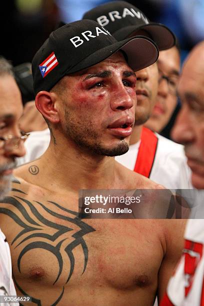 Miguel Cotto of Puerto Rico looks on in the ring after losing to Manny Pacquiao by 12th round TKO during their WBO welterweight title fight at the...