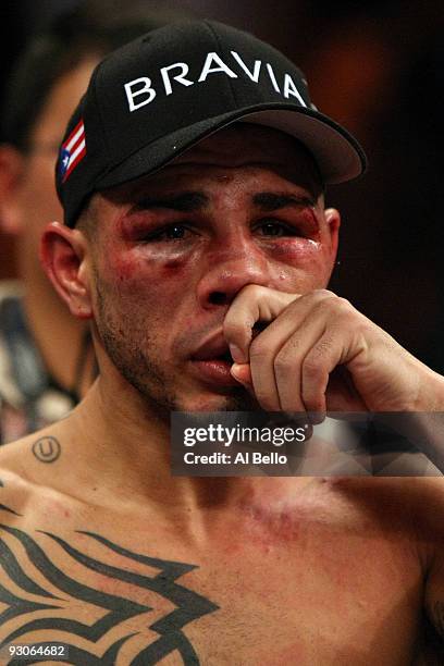 Miguel Cotto of Puerto Rico looks on in the ring after losing to Manny Pacquiao by 12th round TKO during their WBO welterweight title fight at the...