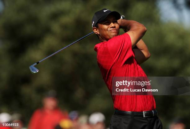 Tiger Woods of the USA plays an approach shot on the 16th hole during the final round of the 2009 Australian Masters at Kingston Heath Golf Club on...