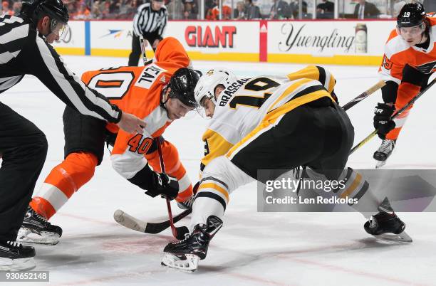 Jordan Weal of the Philadelphia Flyers prepares to face-off against Derick Brassard of the Pittsburgh Penguins on March 7, 2018 at the Wells Fargo...