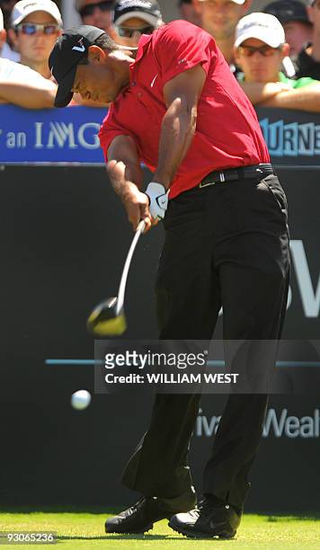 Tiger Woods of the US tees off on the way to winning the Australian Masters golf tournament during the final round at the Kingston Heath course in...