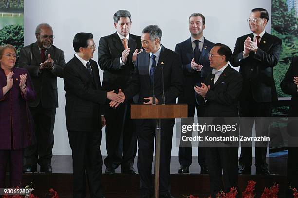 Singapore's Prime Minister Lee Hsien Loong speaks surrounded by APEC Leaders at the declaration ceremony at the end of the the APEC Summit in in...