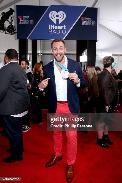 Chris Mazdzer poses in the press room during the 2018 iHeartRadio Music Awards which broadcasted live on TBS, TNT, and truTV at The Forum on March...