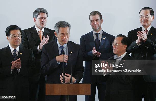 Singapore's Prime Minister Lee Hsien Loong speaks surrounded by APEC Leaders at the declaration ceremony at the end of the the APEC Summit in in...