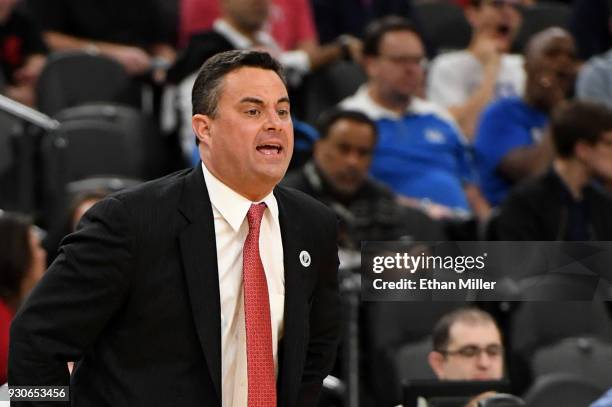 Head coach Sean Miller of the Arizona Wildcats yells to his players during a semifinal game of the Pac-12 basketball tournament against the UCLA...