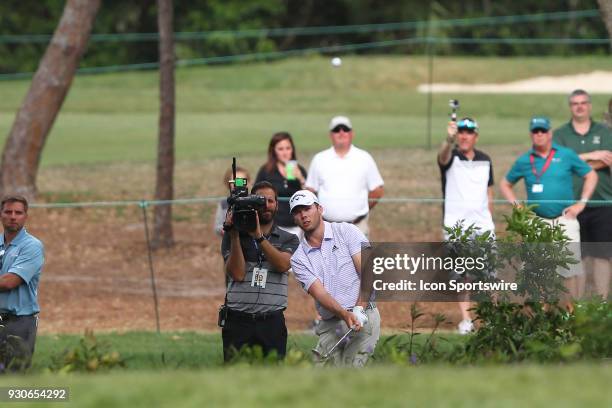 Sam Burns attempts to chip back onto the 16th green after pushing his approach shot far left during the final round of the Valspar Championship on...