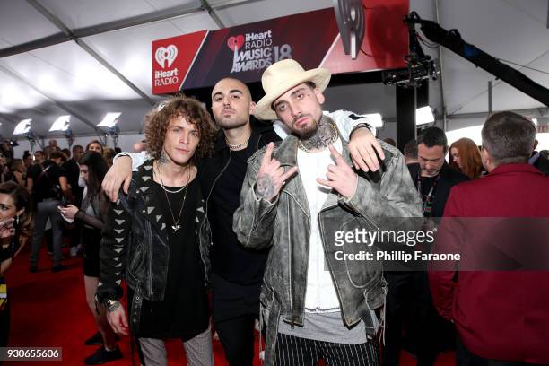 Trevor Dahl, KEVI and Matthew Russell of Cheat Codes pose in the press room during the 2018 iHeartRadio Music Awards which broadcasted live on TBS,...