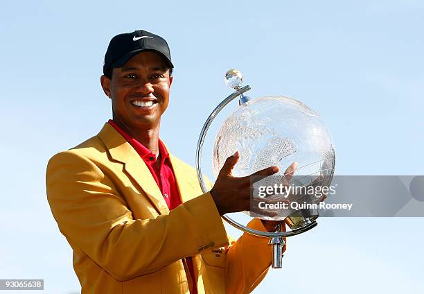 Tiger Woods of the USA poses with the trophy after the final round of the 2009 Australian Masters at Kingston Heath Golf Club on November 15, 2009 in...