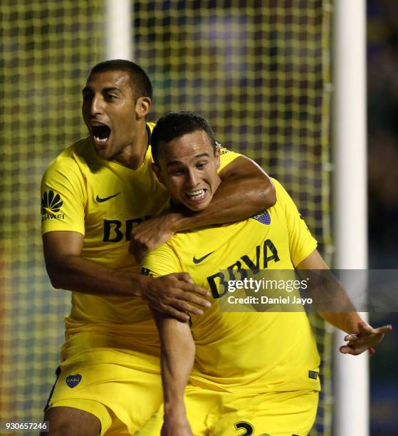 Leonardo Jara of Boca Juniors celebrates with teammate Ramon Abila of Boca Juniors after scoring during a match between Boca Juniors and Tigre as...