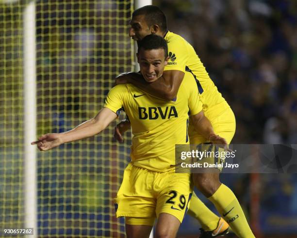 Leonardo Jara of Boca Juniors celebrates with teammate Ramon Abila of Boca Juniors after scoring during a match between Boca Juniors and Tigre as...