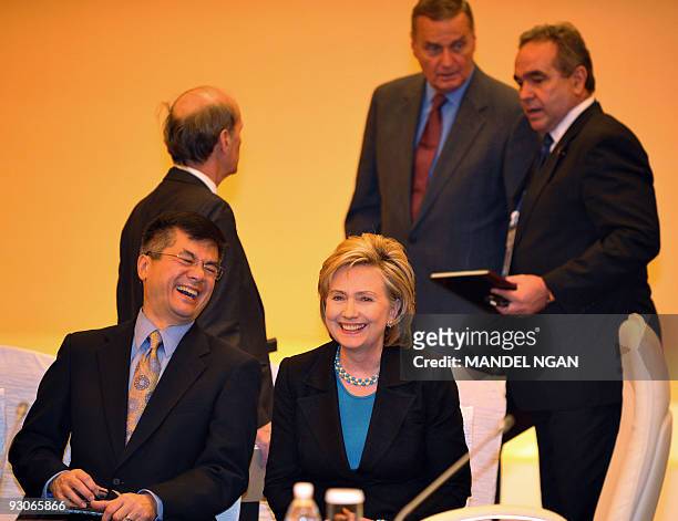 Commerce Secretary Gary Locke shares a laugh with Secretary of State Hillary Clinton before the start of the ASEAN-US leaders meeting at a hotel in...