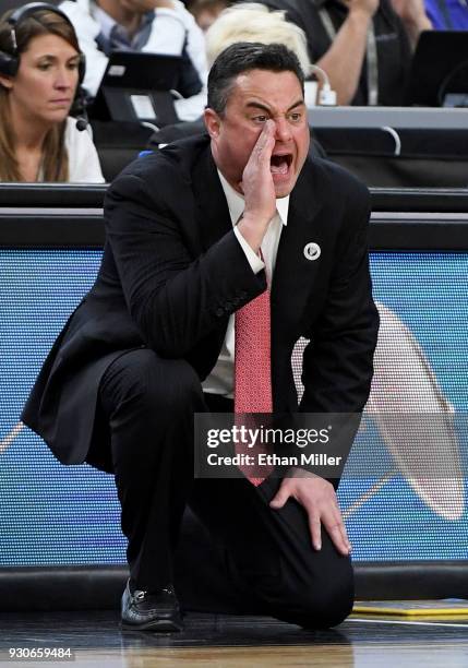 Head coach Sean Miller of the Arizona Wildcats yells to his players during a semifinal game of the Pac-12 basketball tournament against the UCLA...