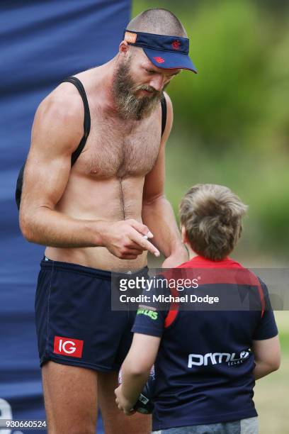 Max Gawn of the Demons gestures to a fan during a Melbourne Demons AFL training session at Gosch's Paddock on March 12, 2018 in Melbourne, Australia.