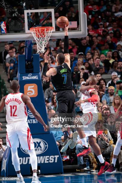 Dwight Powell of the Dallas Mavericks shoots the ball during the game against the Houston Rockets on March 11, 2018 at the American Airlines Center...