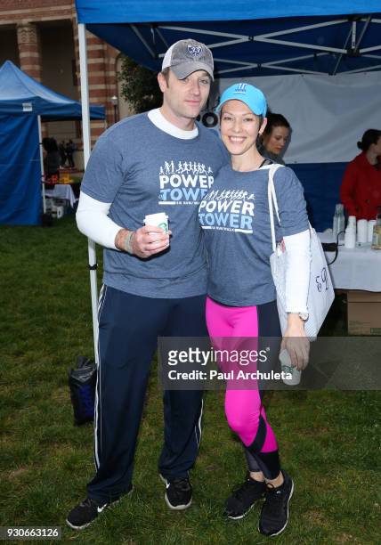 Actors Tom Degnan and Erin Cummings attend the "Power Of Tower" run/walk at UCLA on March 11, 2018 in Los Angeles, California.