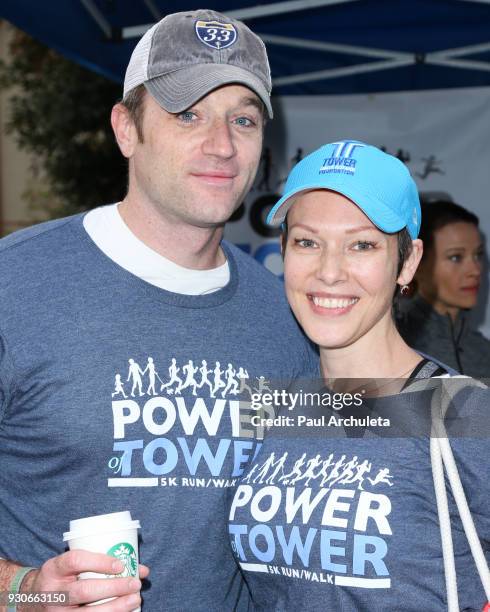 Actors Tom Degnan and Erin Cummings attend the "Power Of Tower" run/walk at UCLA on March 11, 2018 in Los Angeles, California.