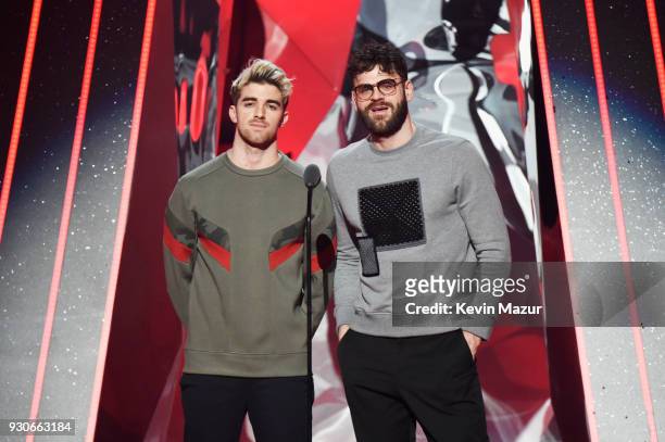 Andrew Taggart and Alex Pall of The Chainsmokers speak onstage during the 2018 iHeartRadio Music Awards which broadcasted live on TBS, TNT, and truTV...