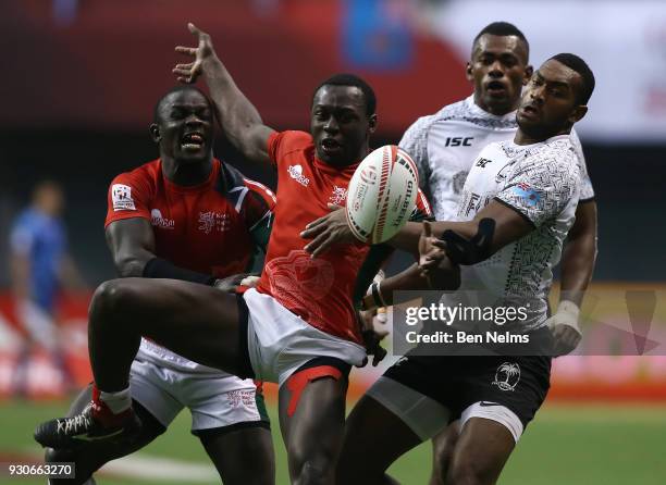 Mesulame Kunavula of Fiji fights for the ball with Billy Odhiambo of Kenya during the gold medal game at Canada Sevens, the Sixth round of the HSBC...