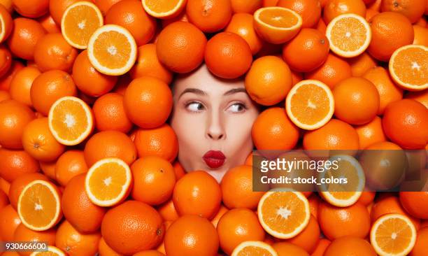 delicious oranges - beautiful romanian women stock pictures, royalty-free photos & images