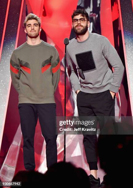 Andrew Taggart and Alex Pall of The Chainsmokers speak onstage during the 2018 iHeartRadio Music Awards which broadcasted live on TBS, TNT, and truTV...