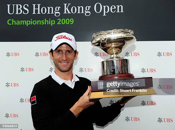 Gregory Bourdy of France holds the winners trophy after winning the UBS Hong Kong Open at the Hong Kong Golf Club on November 15, 2009 in Fanling,...