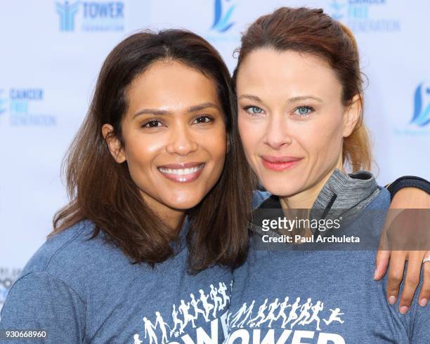 Actors Lesley Ann Brandt and Scottie Thompson attend the "Power Of Tower" run/walk at UCLA on March 11, 2018 in Los Angeles, California.