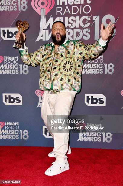 Co-host DJ Khaled, winner of Hip-Hop Song of the Year for 'Wild Thoughts,' poses in the press room during the 2018 iHeartRadio Music Awards which...