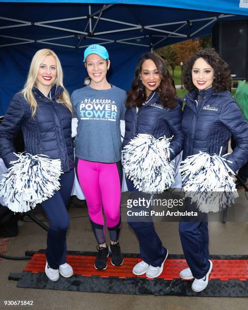 Actress Erin Cummings with the LA Rams Cheerleaders attend the "Power Of Tower" run/walk at UCLA on March 11, 2018 in Los Angeles, California.